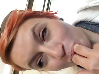 Naughty redhead plays with her pussy in a public bus